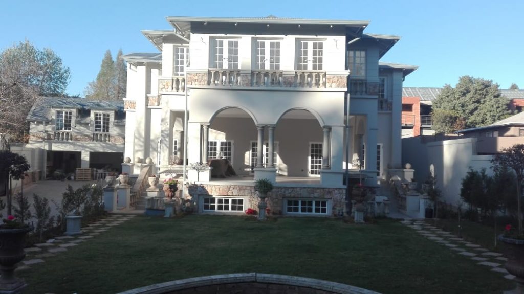 Beautiful home with stone wall with stone works by newlands building projects