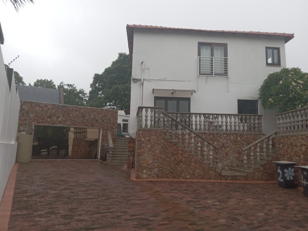 House renovations, garage building, ground level dropping, steps building with concrete balustrades, rock cladding and driveway paving in forest Town, Sandton City