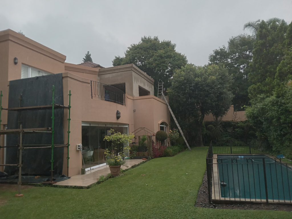 Upper level extension, with concrete slab roof, glass & aluminum sliding door installation, plastering, painting and tiling in Morning Side